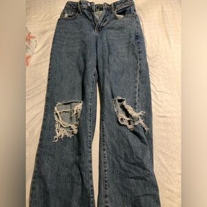 High waisted blue distressed jeans